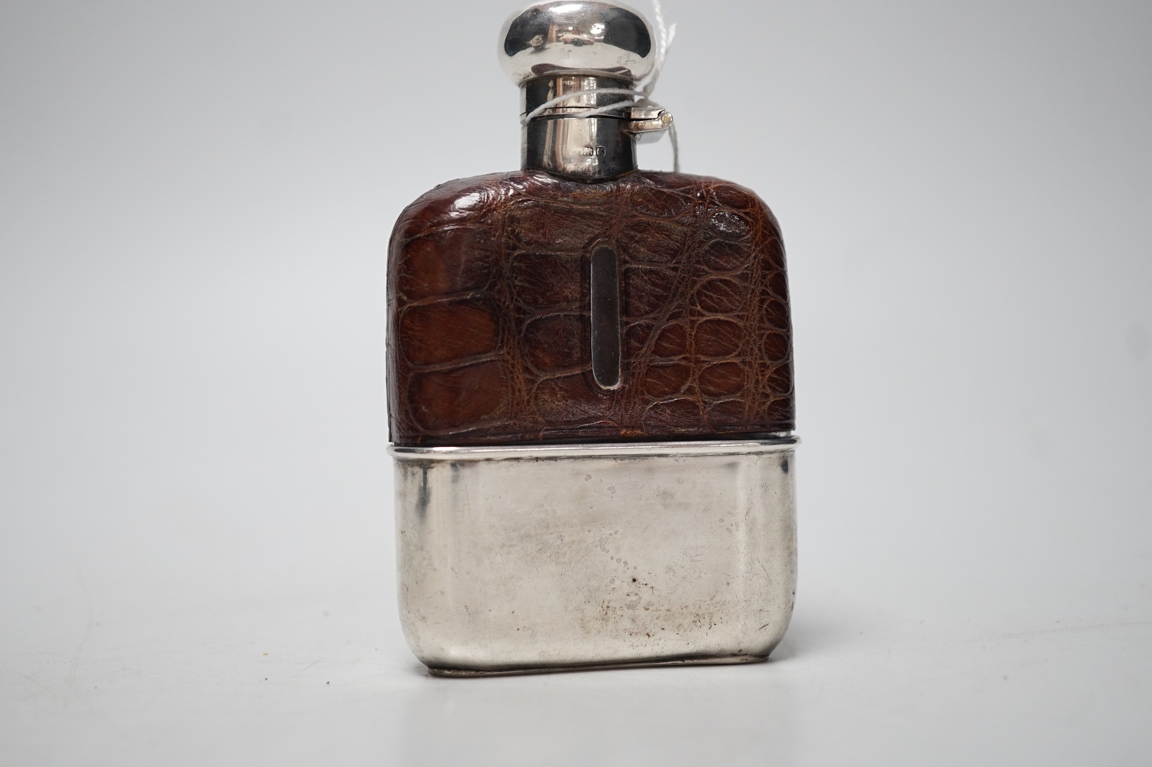 A George V silver and crocodile skin mounted glass hip flask, Chester, 1923, 11.6cm.